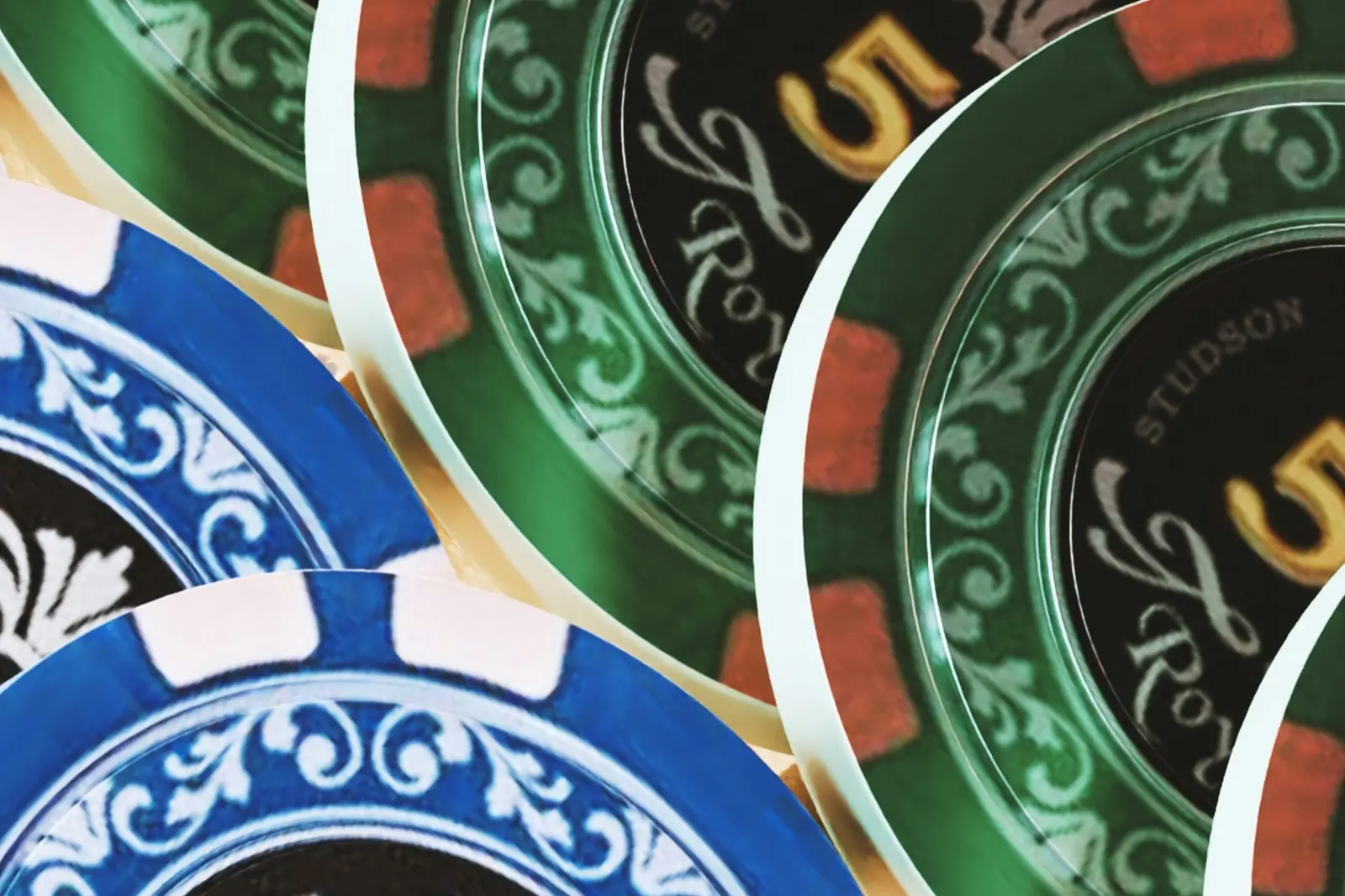 A pile of casino poker chips stacked on a table